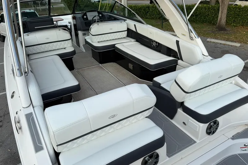  Yacht Photos Pics 2019 Regal 29 OBX boat interior with luxurious white seating and modern dashboard.