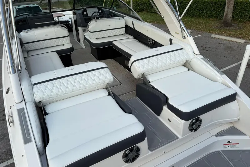  Yacht Photos Pics 2019 Regal 29 OBX boat interior with luxurious white seating and modern design.