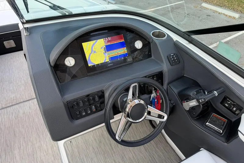  Yacht Photos Pics 2019 Regal 29 OBX boat dashboard with GPS navigation and steering wheel.