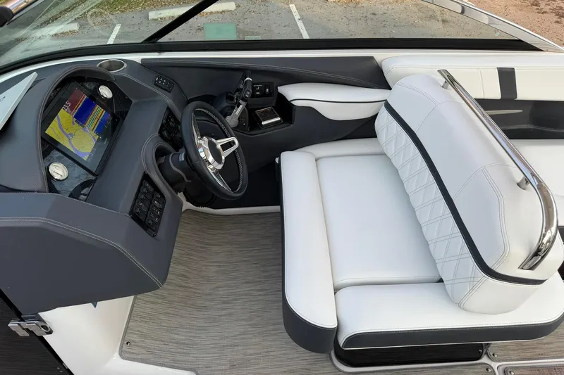  Yacht Photos Pics 2019 Regal 29 OBX boat interior with modern dashboard and white seating.