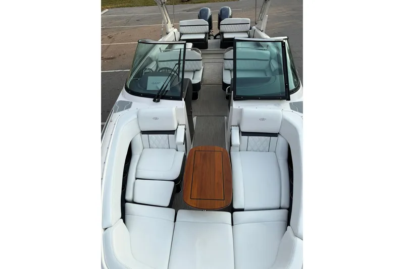  Yacht Photos Pics 2019 Regal 29 OBX boat interior with white seating and wooden table.