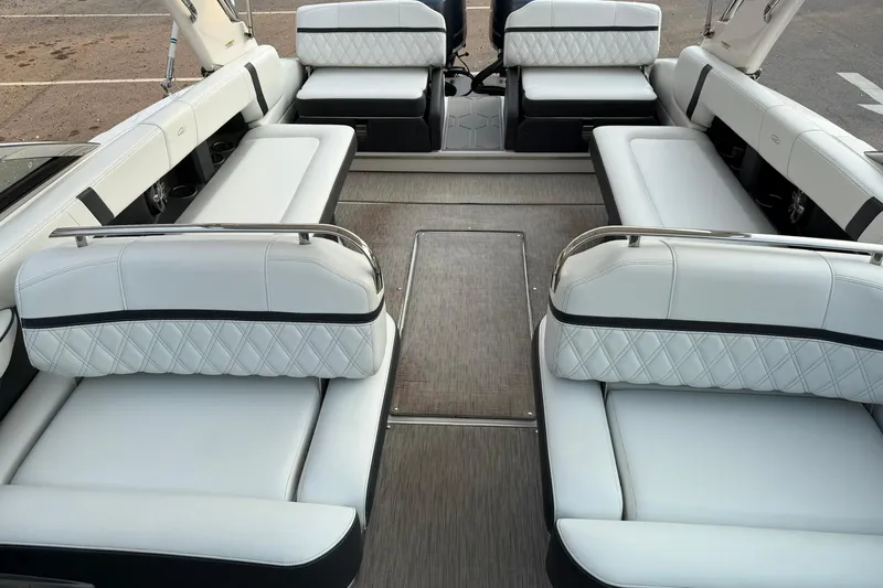  Yacht Photos Pics 2019 Regal 29 OBX boat interior with luxurious white seating and spacious layout.