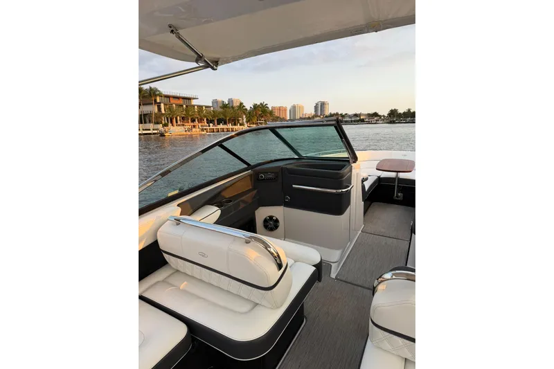  Yacht Photos Pics 2019 Regal 29 OBX boat interior with luxurious seating and waterfront view.