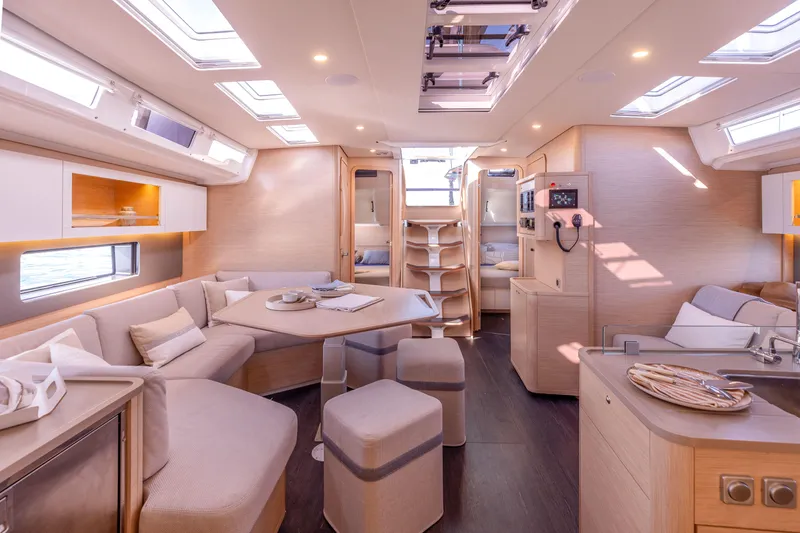  Yacht Photos Pics Luxurious interior of 2025 Dufour 48 yacht with modern furnishings and ample natural light.