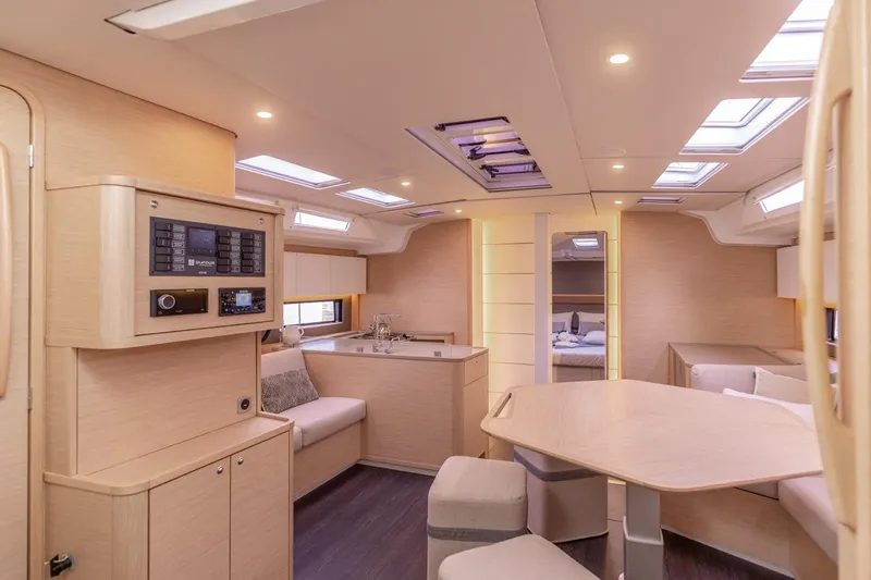  Yacht Photos Pics Luxurious interior of 2025 Dufour 48 yacht with modern furnishings and ample natural light.
