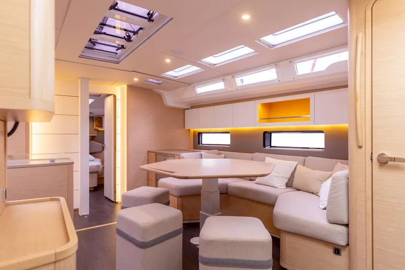  Yacht Photos Pics Luxurious interior of 2025 Dufour 48 yacht with modern seating and skylights.