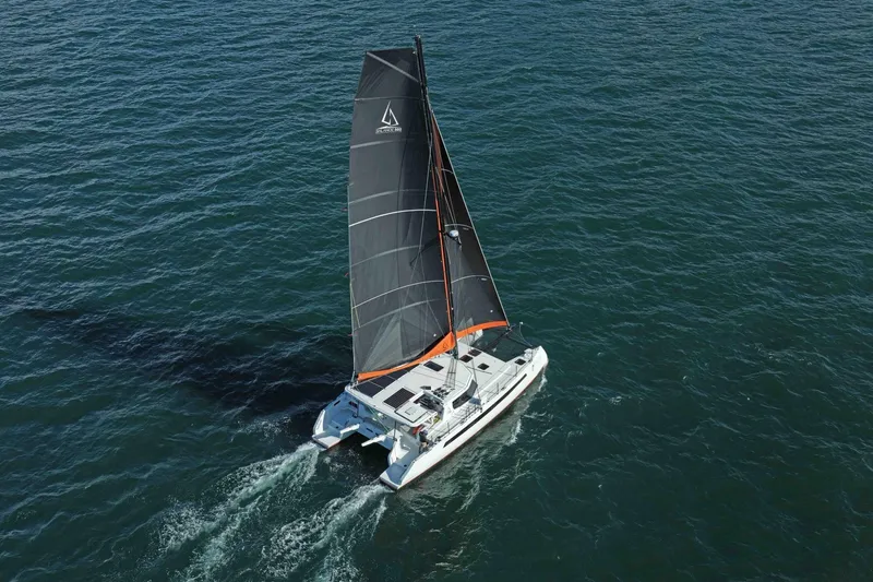  Yacht Photos Pics Aerial view of Balance 502 catamaran sailing on open sea, 2027 model.