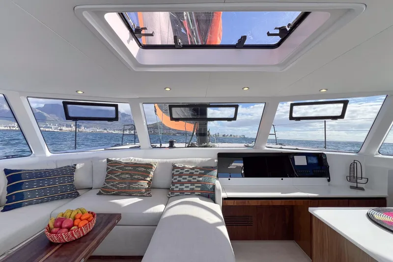  Yacht Photos Pics Luxurious interior of 2027 Balance 502 yacht with panoramic windows and stylish seating.