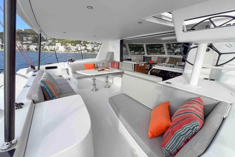  Yacht Photos Pics Luxurious Balance 502 yacht interior with modern seating, vibrant cushions, and scenic ocean view.
