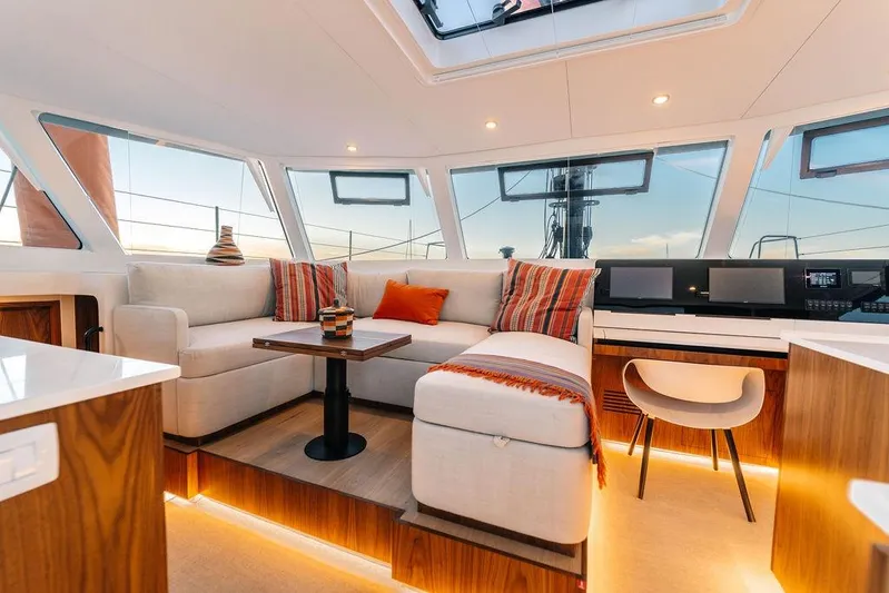  Yacht Photos Pics Luxurious interior of 2027 Balance 502 yacht with modern seating and panoramic windows.
