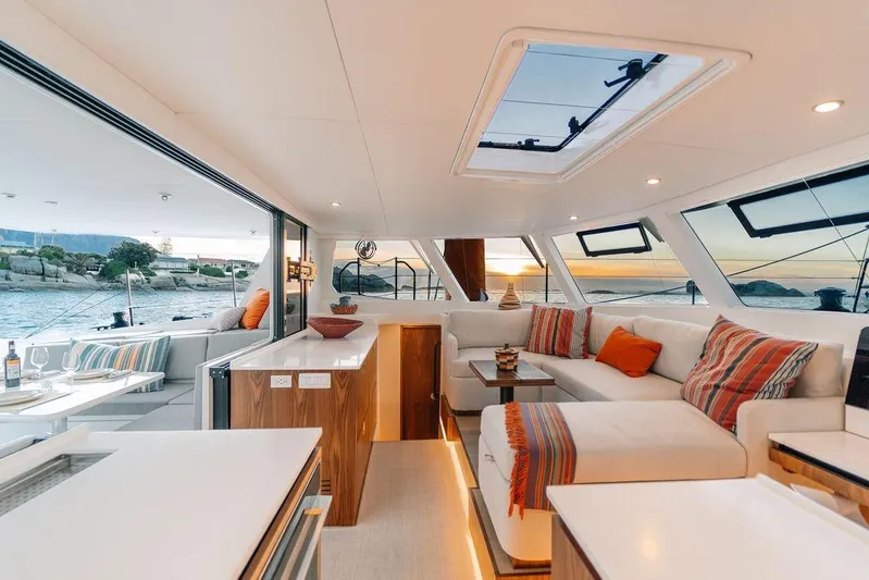  Yacht Photos Pics Luxurious interior of 2027 Balance 502 yacht with sunset view and modern furnishings.