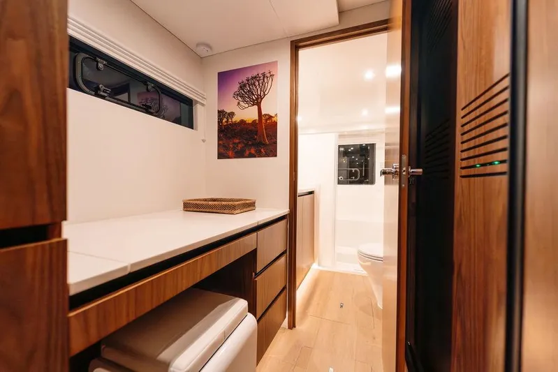  Yacht Photos Pics Modern yacht interior with wooden cabinetry, desk, and bathroom. Balance 502, 2027 model.