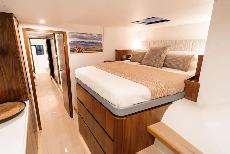  Yacht Photos Pics Luxurious bedroom interior in 2027 Balance 502 yacht, featuring elegant wood finishes and cozy bedding.