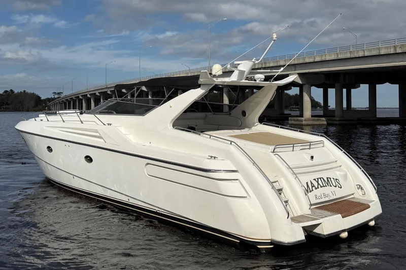  Yacht Photos Pics 1994 Sunseeker Camargue 55 yacht on water near a bridge, rear view.