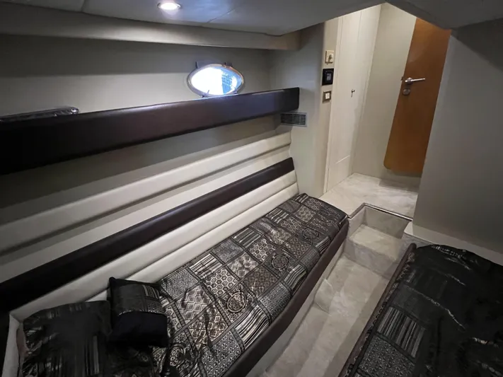  Yacht Photos Pics Interior cabin of 1994 Sunseeker Camargue 55 yacht with modern decor and bedding.