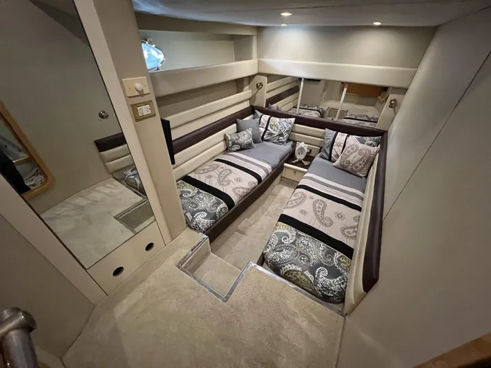  Yacht Photos Pics Luxurious interior of 1994 Sunseeker Camargue 55 yacht with twin beds and elegant decor.