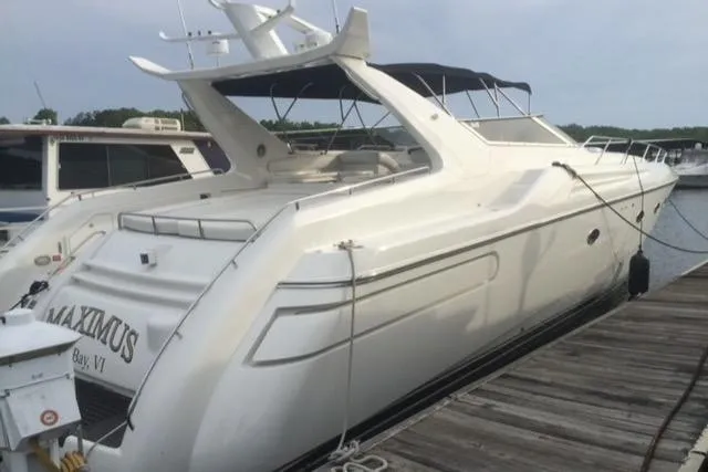  Yacht Photos Pics 1994 Sunseeker Camargue 55 yacht docked at a marina.