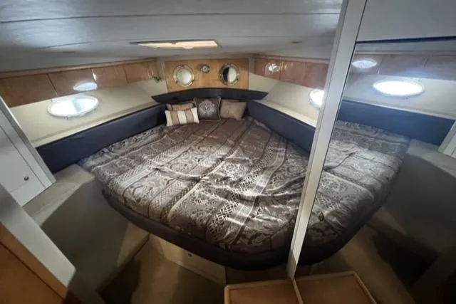  Yacht Photos Pics Luxurious cabin interior of a 1994 Sunseeker Camargue 55 yacht with a spacious bed.
