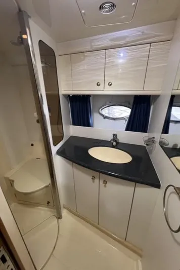  Yacht Photos Pics Luxurious bathroom interior of 1994 Sunseeker Camargue 55 yacht with modern amenities.