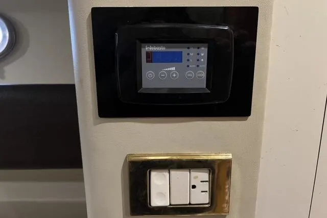  Yacht Photos Pics Control panel and switches inside a 1994 Sunseeker Camargue 55 yacht.