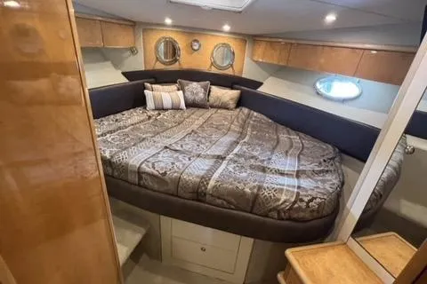  Yacht Photos Pics Luxurious cabin interior of 1994 Sunseeker Camargue 55 yacht with cozy bedding.
