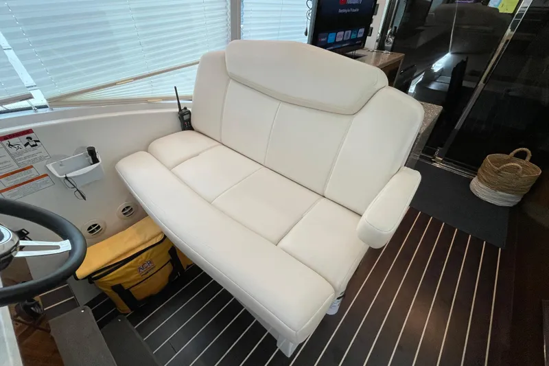 Plan B Yacht Photos Pics Luxurious white seating in 2012 Cruisers Yachts 48 Cantius interior, featuring modern design.