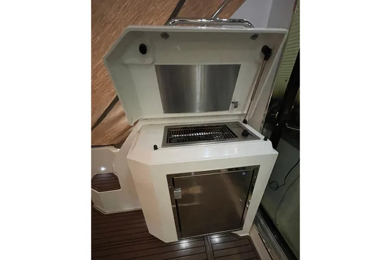 Plan B Yacht Photos Pics Outdoor grill and fridge on 2012 Cruisers Yachts 48 Cantius, featuring sleek design.