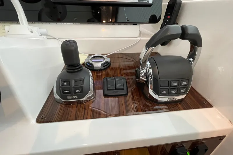 Plan B Yacht Photos Pics Control panel of 2012 Cruisers Yachts 48 Cantius with joystick and throttle controls.