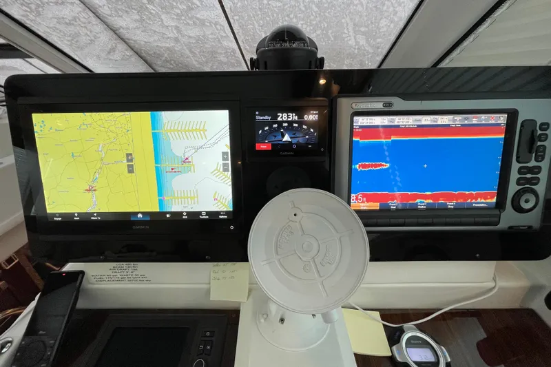 Plan B Yacht Photos Pics Control panel of a 2012 Cruisers Yachts 48 Cantius with navigation displays.