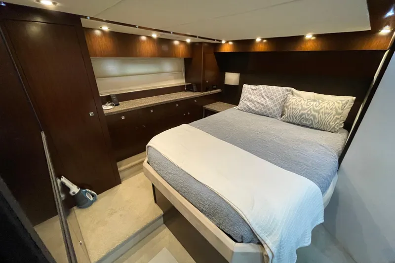 Plan B Yacht Photos Pics Luxurious bedroom interior of 2012 Cruisers Yachts 48 Cantius with modern design and cozy bedding.