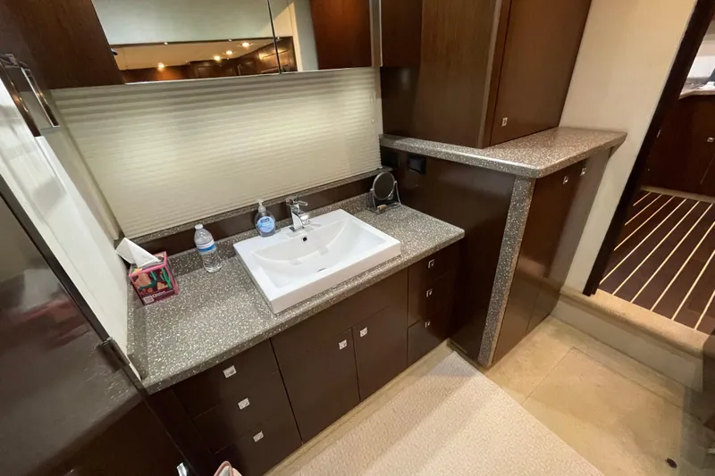 Plan B Yacht Photos Pics Luxurious bathroom interior of 2012 Cruisers Yachts 48 Cantius with modern sink and cabinetry.