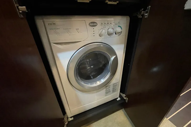 Plan B Yacht Photos Pics Washing machine inside 2012 Cruisers Yachts 48 Cantius, compact and efficient design.