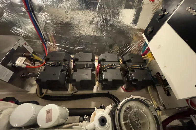 Plan B Yacht Photos Pics Engine room of 2012 Cruisers Yachts 48 Cantius with battery setup and wiring.
