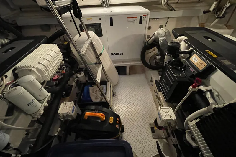 Plan B Yacht Photos Pics Engine room of 2012 Cruisers Yachts 48 Cantius with Kohler generator and Volvo components.