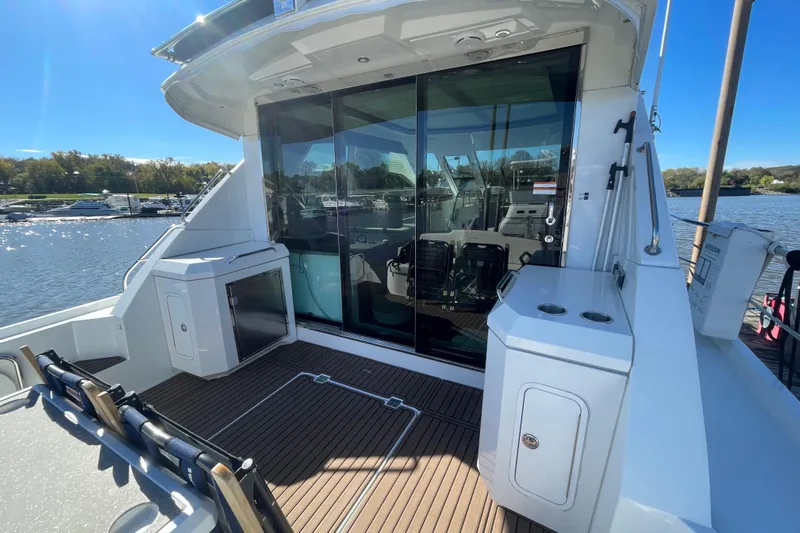 Plan B Yacht Photos Pics 2012 Cruisers Yachts 48 Cantius deck with sliding glass doors and scenic water view.