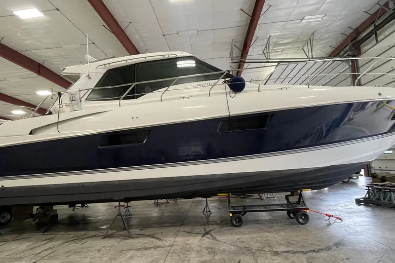 Plan B Yacht Photos Pics 2012 Cruisers Yachts 48 Cantius in indoor storage, side view.