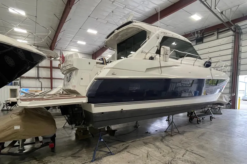 Plan B Yacht Photos Pics 2012 Cruisers Yachts 48 Cantius in indoor storage, showcasing sleek design and modern features.