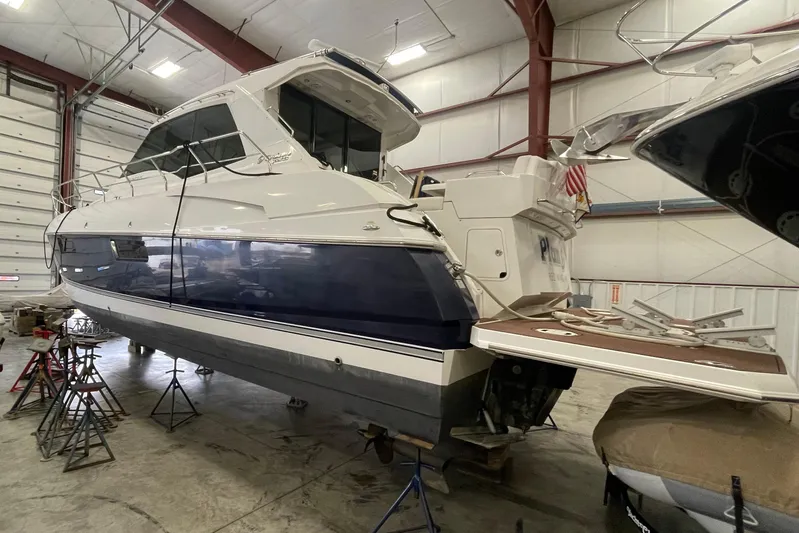 Plan B Yacht Photos Pics 2012 Cruisers Yachts 48 Cantius in a boat storage facility, side view.