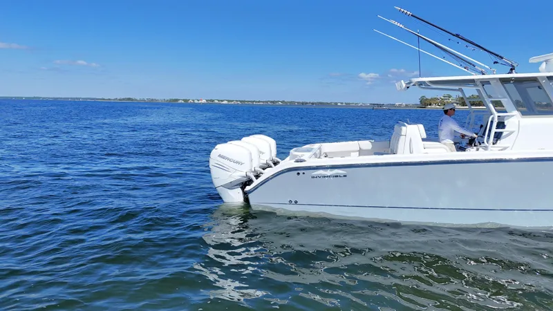 Engine Warranty Yacht Photos Pics 2020 Invincible 37 Catamaran on calm blue waters, featuring powerful outboard engines.