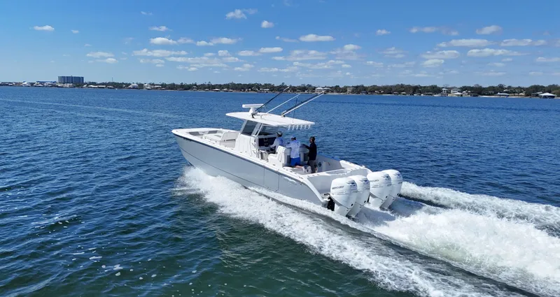 Engine Warranty Yacht Photos Pics 2020 Invincible 37 Catamaran cruising on open water under clear skies.