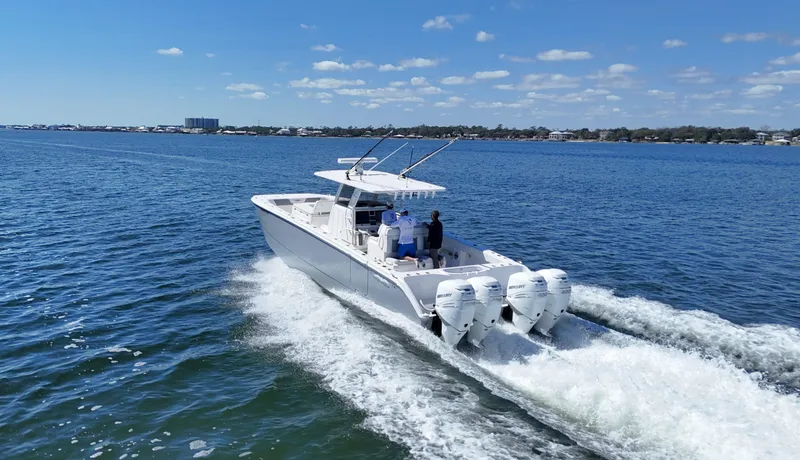 Engine Warranty Yacht Photos Pics 2020 Invincible 37 Catamaran cruising on open water under a clear blue sky.