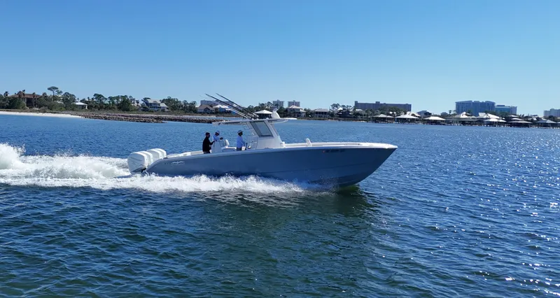 Engine Warranty Yacht Photos Pics 2020 Invincible 37 Catamaran cruising on a sunny day in open water.