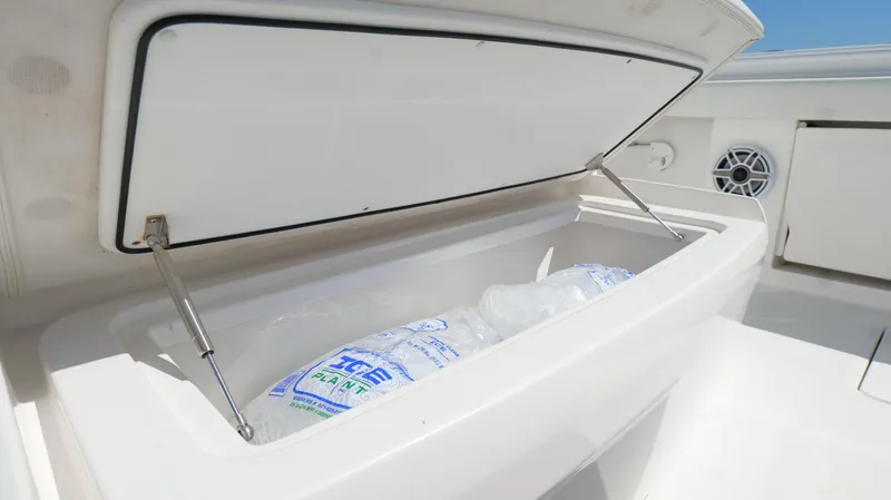 Engine Warranty Yacht Photos Pics Open storage compartment on 2020 Invincible 37 Catamaran with ice bags inside.