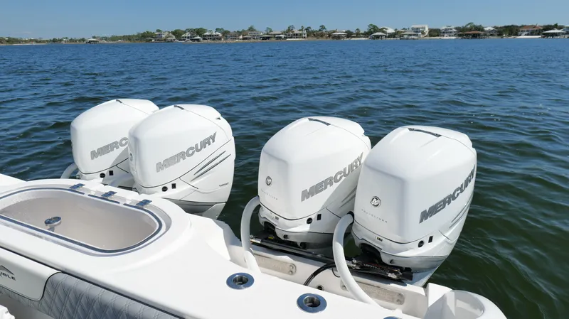 Engine Warranty Yacht Photos Pics 2020 Invincible 37 Catamaran with four Mercury outboard engines on a calm water backdrop.