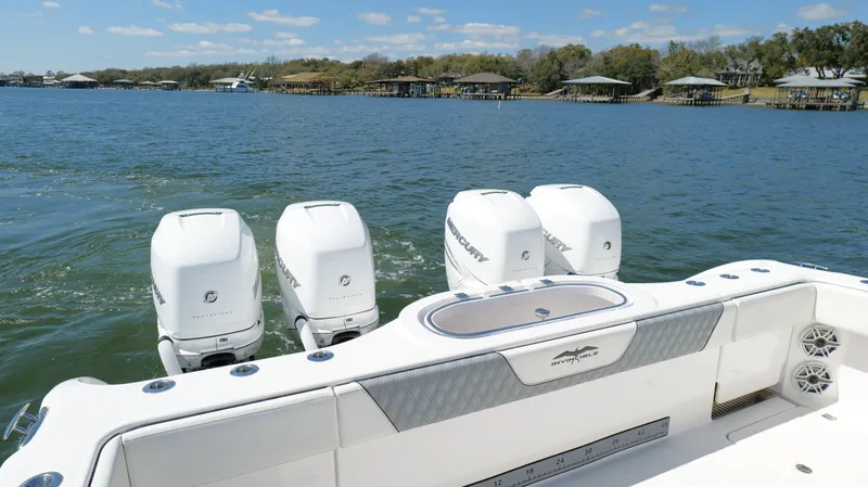 Engine Warranty Yacht Photos Pics 2020 Invincible 37 Catamaran with four outboard engines on a scenic lake.