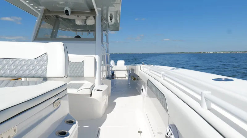 Engine Warranty Yacht Photos Pics 2020 Invincible 37 Catamaran on open water, showcasing sleek design and spacious deck.