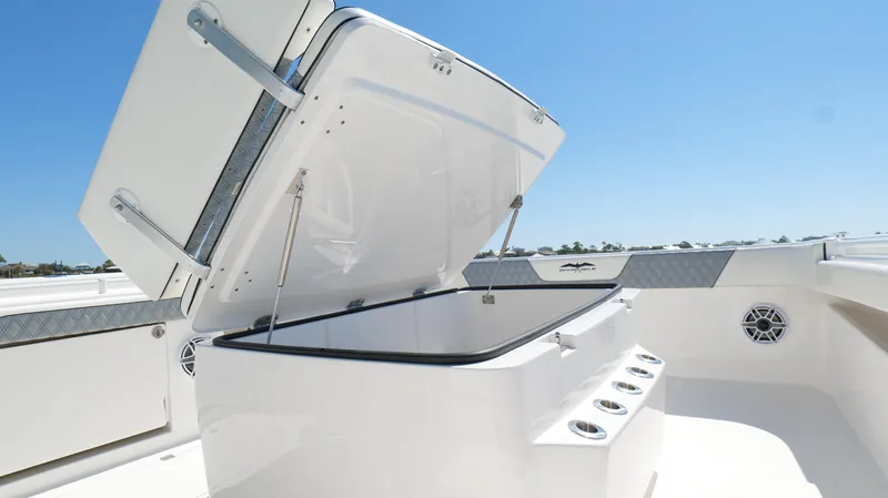 Engine Warranty Yacht Photos Pics Open storage compartment on 2020 Invincible 37 Catamaran under clear blue sky.