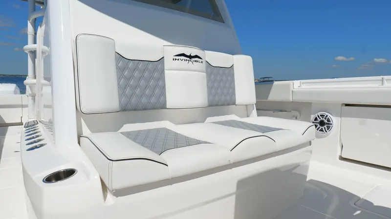 Engine Warranty Yacht Photos Pics Invincible 37 Catamaran 2020, luxurious seating with diamond-patterned upholstery on deck.