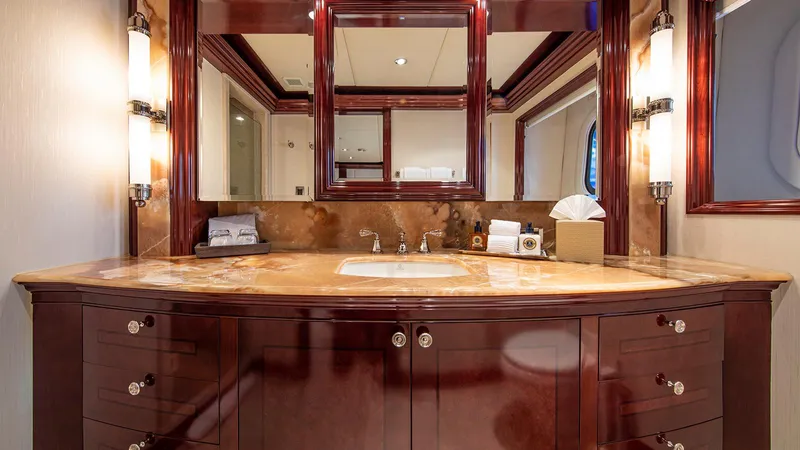 La Dea II Yacht Photos Pics Luxurious bathroom vanity on 2007 Trinity Yachts Tri Deck Motor Yacht, featuring elegant wood cabinetry.