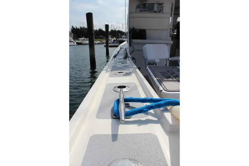 Miss Jennie Yacht Photos Pics 2008 H&H Marine 38 boat deck with blue rope, docked in marina.